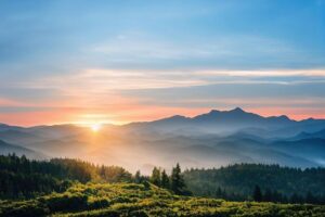 Premium Photo _ Beautiful ancient mountains at sunset in the evening sunlight and in the fog